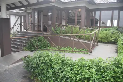 a staircase in a building with plants at Jeevess Retreat Wayanad in Wayanad