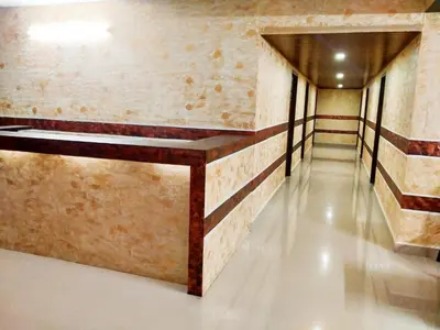 a room with a bench on the wall at Rambler Garden Resort in Idukki