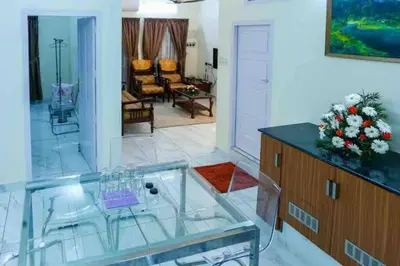 a large living room with a glass table at Belljem Homes -your own private resort -6 BHK B in Trichūr