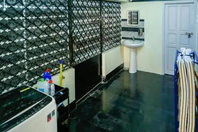 a bathroom with a sink and a toilet at Belljem Homes -your own private resort -5 BHK in Trichūr