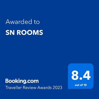 a screenshot of a cell phone with the text awarded to sn rooms at SN ROOMS in Perumbavoor