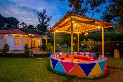 a colorful play area in the yard of a house at goSTOPS Ooty in Ooty