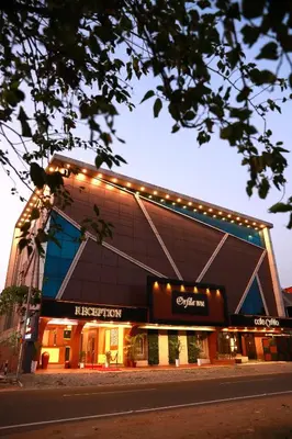 a large building with lights on top of it at ORFILA INN Airport Hotel in Angamali