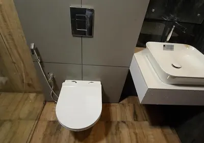 a bathroom with a white toilet and a sink at The Lavender Resort Waynad in Vaduvanchal