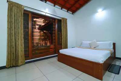 a bedroom with a bed and a large window at SaffronStays Coorg Toddy Farms, Coorg in Madikeri