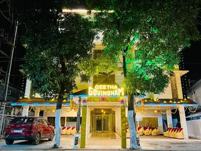 a building with a car parked in front of it at Geetha Govindham in Guruvāyūr