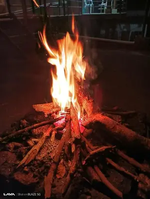 a fire is burning in a fire pit at Krishna Kuteera in Siddapur