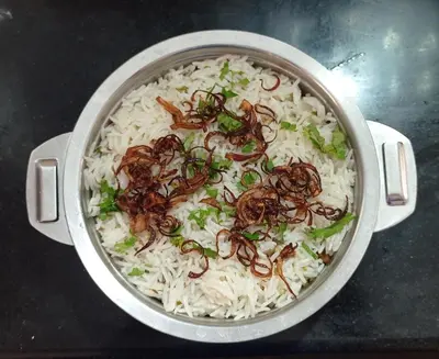 a pot filled with rice and mushrooms at Perch by the sea in Kannur