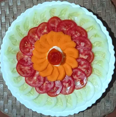 a cake in the shape of a flower on a plate at Perch by the sea in Kannur