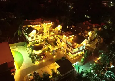 an aerial view of a building at night with lights at Feliz Homes- Near to Kottakkal Arya Vaidya Sala in Kottakkal