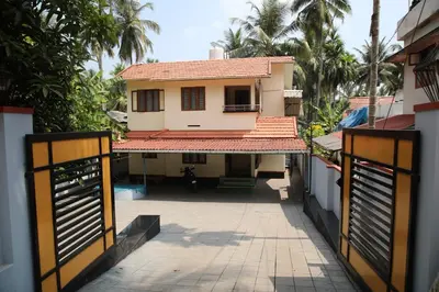 a view of a house from the street at Saaketh Holiday Home in Kozhikode