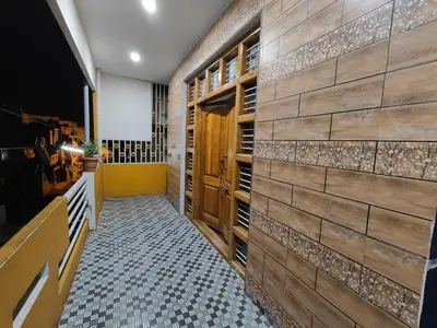 a tasting room with a wall of wooden wine racks at Yellow House in Mysore