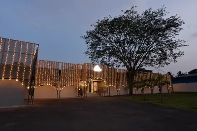 a building with christmas lights on the side of it at Shine Residency in Mysore