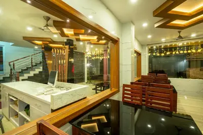 a dining room with aasteryasteryasteryasteryasteryasteryasteryasteryasteryasteryastery at Daan Regency in Trichūr