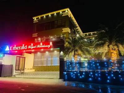 a building with a sign that reads emerald event security at Emerald Royal Residency in Cochin