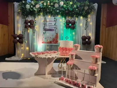 a table with a cake and a table with cupcakes at Emerald Royal Residency in Cochin