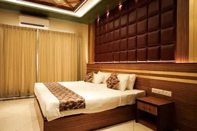 a bedroom with a large bed in a room at Valluvanad Residency in Perintalmanna
