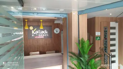 a lobby with a sign on the door of a building at Kallada Residency in Perintalmanna