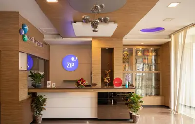 a lobby of a drugstore with a bar in the middle at THE PEBBLE Boutique Hotel in Tiruppūr