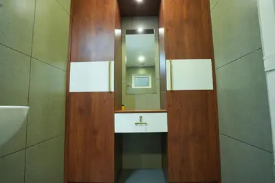 a bathroom with a sink and a mirror at Misty Range Resorts , Marayoor in Marayoor