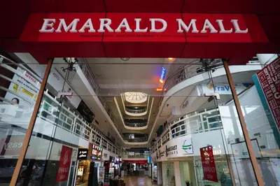 a mall with a red sign that reads emergency mall at Emarald Hotel Calicut in Kozhikode