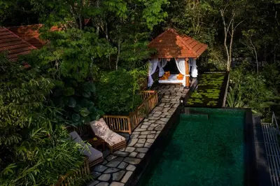 a backyard with a swimming pool and a gazebo at Earthitects Holiday Experiences,Wayanad in Kalpetta