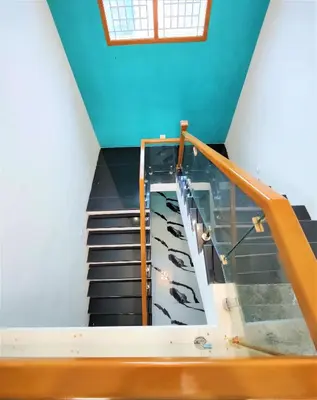 a stair case with a glass case and stairs at Coimbatore Premium Private Villa a FAMILY RESORT kids, celebration hall in Coimbatore