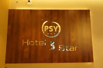 a wooden wall with a hp sign on it at Hotel PSY in Mettuppālaiyam