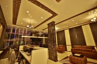 a room with a lobby with couches and a table at The Mysore Grand in Mysore