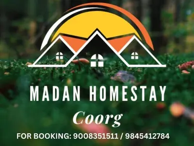 a logo for a real estate company with a house at Madan Homestay in Napoklu