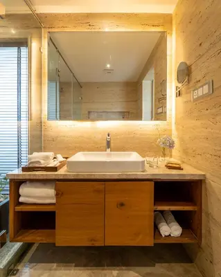 a bathroom with a sink and a large mirror at Stays By MindEscapes in Ketti