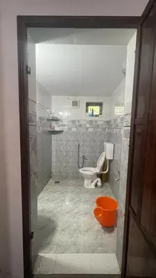 a bathroom with a toilet and a sink at 3 bedroom country home with a lush full backyard in Trichūr
