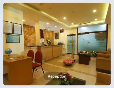 a lobby of a hospital with a waiting room at Hotel Sasthapuri in Kozhikode