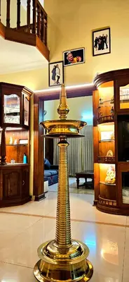 a gold trophy on the floor in a room at KRISHNAGIRI homes in Guruvāyūr