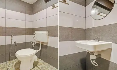 a bathroom with a toilet and a sink at Itsy Hotels Sapphire Residency in Manjeri