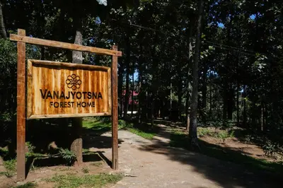 a sign for the yawmitehedon forest preserve at VanaJyotsna Forest Home in Marayoor