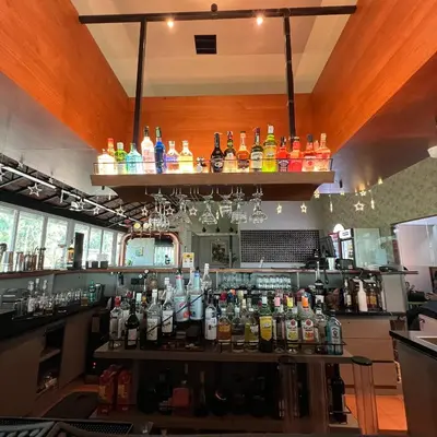 a bar with a lot of bottles of alcohol at PEARL MAHE in Mahe