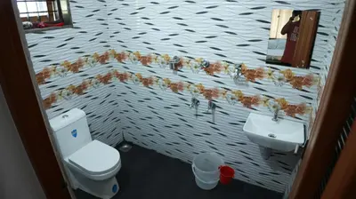 a bathroom with a toilet and a sink at Thas apartment near rajagiri hospital in Alwaye