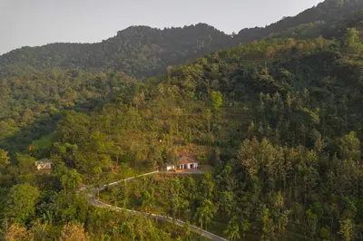 an aerial view of a house on a mountain at La Grove 2BHK with Stunning View - Kannur in Wayanad