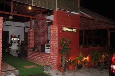 a red brick building with a sign that reads happy anniversary at Coorg Happy Estate Stay in Madikeri