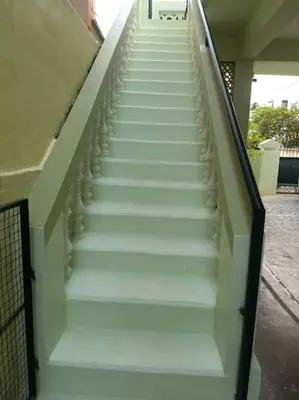 a stairway leading up to a building at Single room Homestay Second floor in Palani