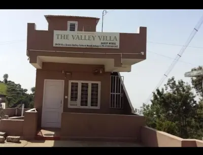 a building with a sign that reads the valley villa at The Valley Villa in Kotagiri