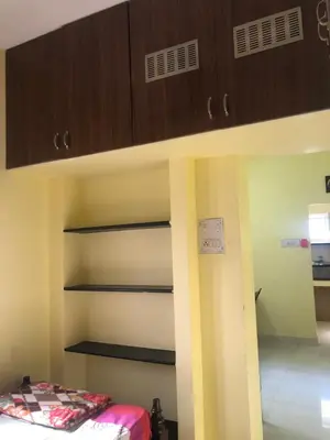 a bunk bed in a room with a bed gmaxwell gmaxwell gmaxwell gmaxwell gmaxwell at Aishwarya Nivas in Palani