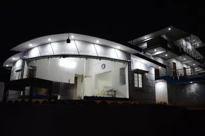 a lit up house at night at DIAMOND HILL VIEW in Ketti