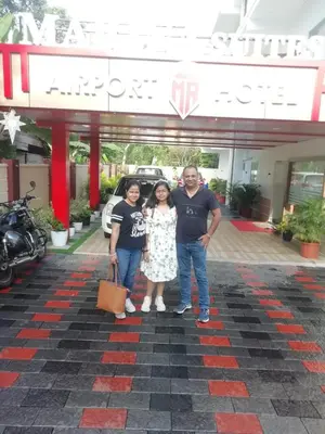 a group of people standing in front of a store at MARINA SUITES AIRPORT HOTEL in Cochin