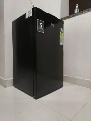 a black refrigerator with the number six on it at Amberleaf Estate 4BHK Homestay Coorg by Homeyhuts in Virajpet