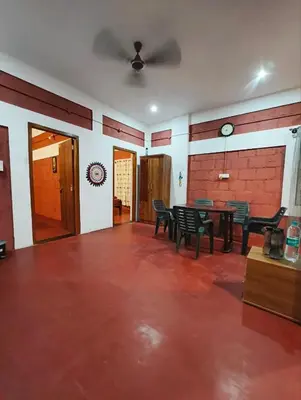 an empty room with a table and chairs in it at Amberleaf Estate 4BHK Homestay Coorg by Homeyhuts in Virajpet