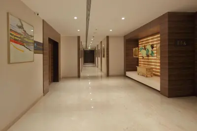 a hallway of a building with a long hallway sidx sidx sidx at Distrikt 9 in Palakkad