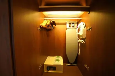 a bathroom with a phone and a toilet in it at Distrikt 9 in Palakkad
