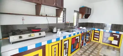 a kitchen with a lego inspired counter top at Johns Villa in Sultan Bathery